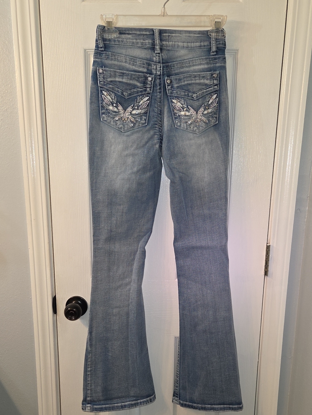 Light Blue Flare Jeans with Decorative Back Pockets